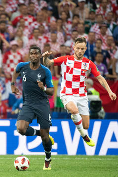 Paul Pogba of France and Ivan Rakitic of Croatia competes