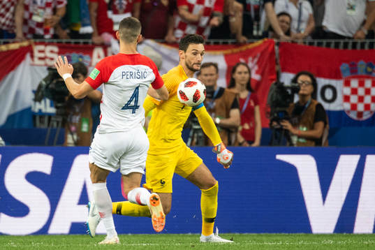 goalkeeper Hugo Lloris of France takes the ball in front of