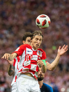 Luka Modric of Croatia with a header