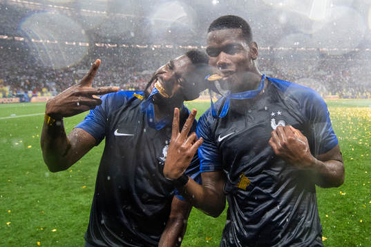 Samuel Umtiti and Paul Pogba of France celebrate