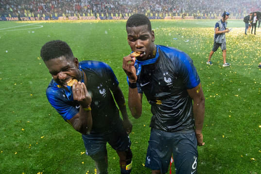 Samuel Umtiti and Paul Pogba of France celebrate