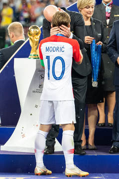 FIFA president Gianni Infantino, hand out a silver medal to