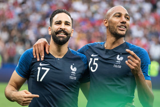 Adil Rami and Steven Nzonzi of France celebrate