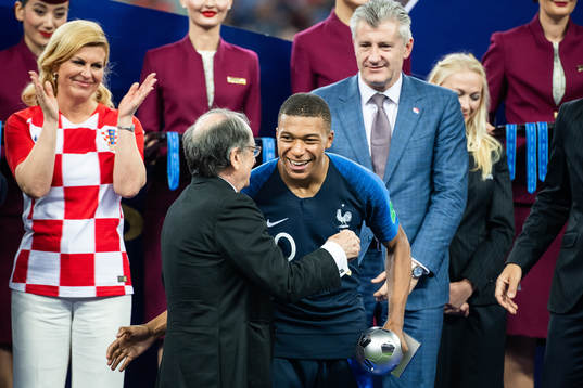 Kylian Mbappe of France with the award for best young