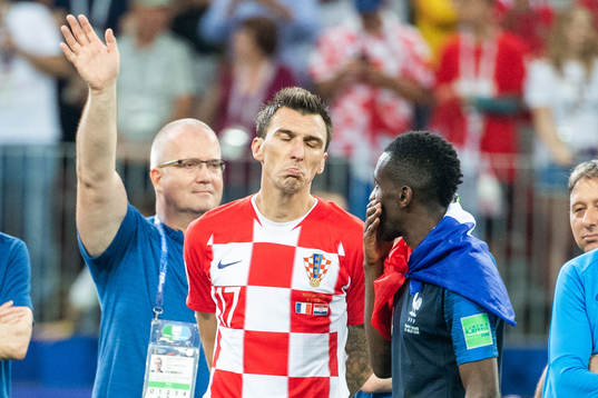 Mario Mandzukic of Croatia looks dejected while talking to