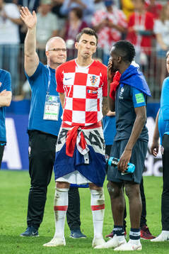 Mario Mandzukic of Croatia looks dejected while talking to