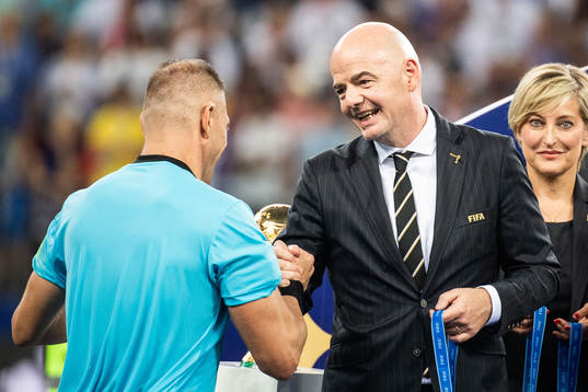 FIFA president Gianni Infantino, hand out a medal to