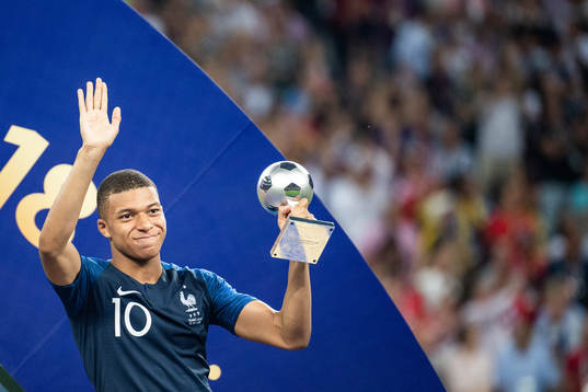 Kylian Mbappe of France with the award for best young