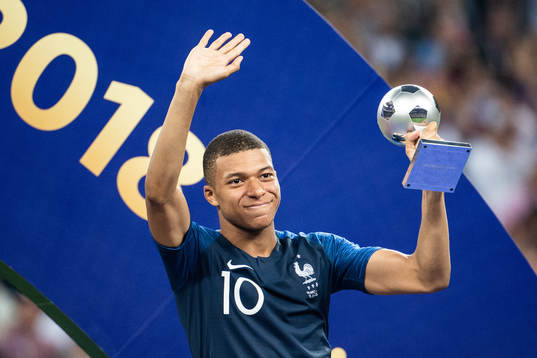 Kylian Mbappe of France with the award for best young