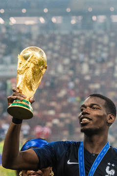Paul Pogba of France with the trophy while celebrating