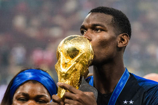 Paul Pogba of France kisses the trophy while celebrating