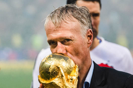 Head coach Didier Deschamps of France kisses the trophy