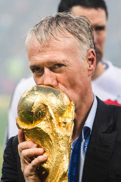 Head coach Didier Deschamps of France kisses the trophy