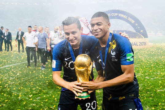 Florian Thauvin and Kylian Mbappe of France celebrates with