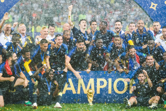 Players of France celebrate with the trophy