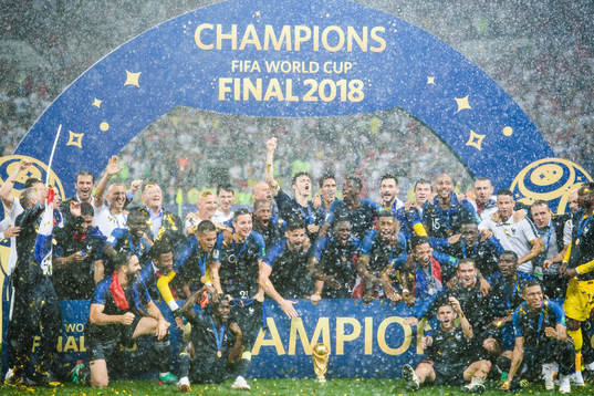 Players of France celebrate with the trophy