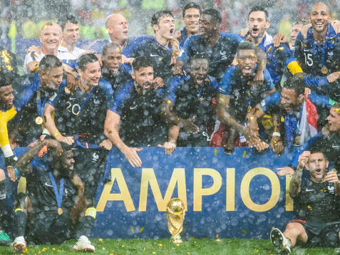 Players of France celebrate with the trophy