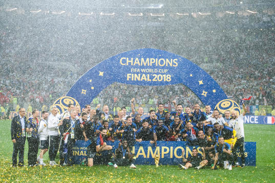 Players of France celebrate with the trophy