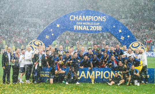 Players of France celebrate with the trophy