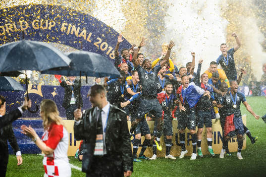 Players of France celebrate with the trophy