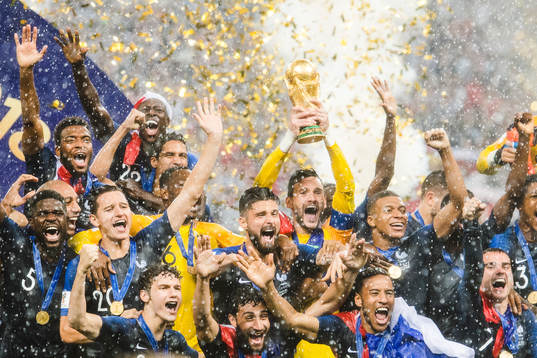 Players of France celebrate with the trophy