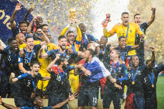 Players of France celebrate with the trophy