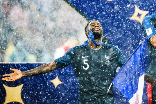 Samuel Umtiti of France celebrates with the gold medal