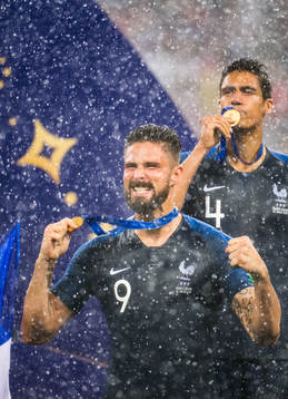 Olivier Giroud and Raphael Varane of France celebrate with