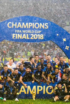 Players of France celebrate with the trophy