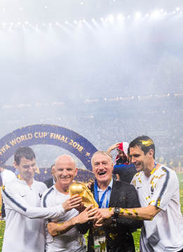 Head coach Didier Deschamps of France and staff celebrate