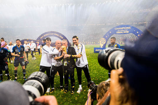 Head coach Didier Deschamps of France and staff celebrate