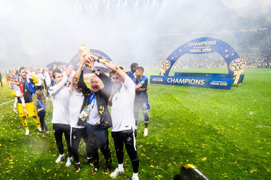 Head coach Didier Deschamps of France and staff celebrate