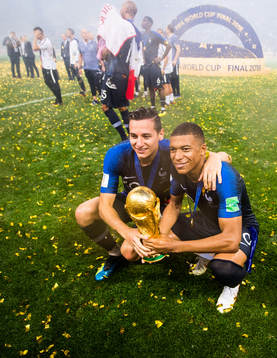 Florian Thauvin and Kylian Mbappe of France celebrate with