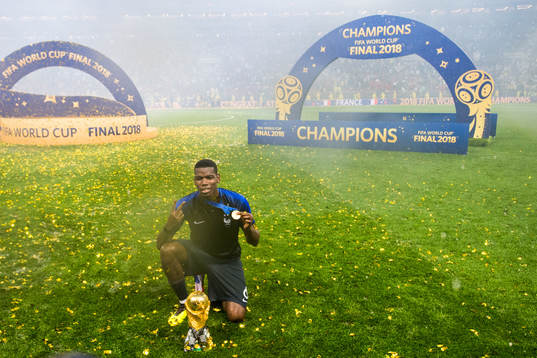 Paul Pogba of France celebrate with the trophy