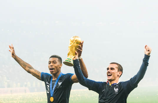Presnel Kimpembe and Antoine Griezmann of France celebrate