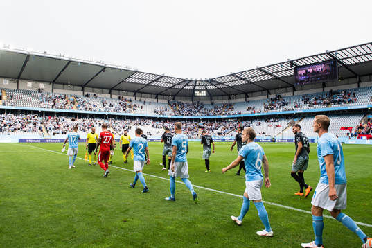 Players of Malmö FF and of Drita enter the pitch
