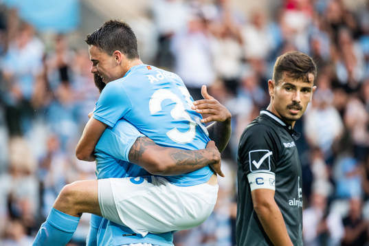 Samuel Adrian jumps into the arms of Carlos Strandberg of