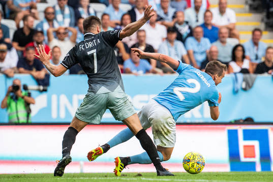 Endrit Krasniqi of Drita tackles Eric Larsson of Malmö FF