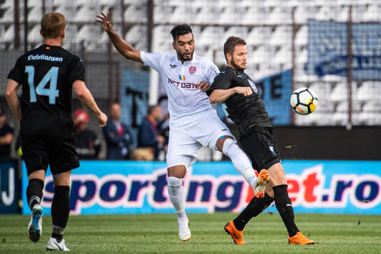 Billel Omrani of Cluj and Lasse Nielsen of Malmö FF