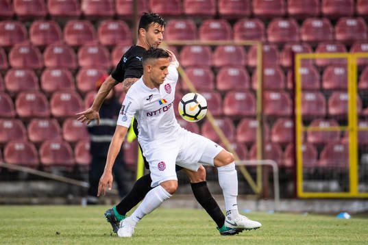 Behrang Safari of Malmö FF and Cristian Manea of Cluj