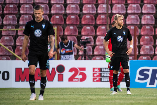 Arnór Ingvi Traustason and Rasmus Bengtsson looks dejected