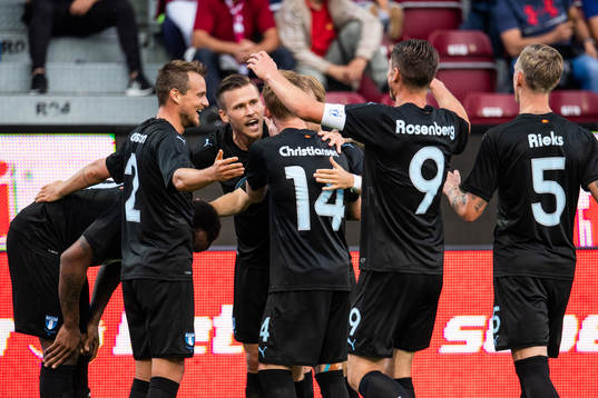 Carlos Strandberg (left) of Malmö FF celebrates scoring