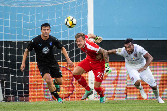 Behrang Safari and goalkeeper Johan Dahlin of Malmö FF