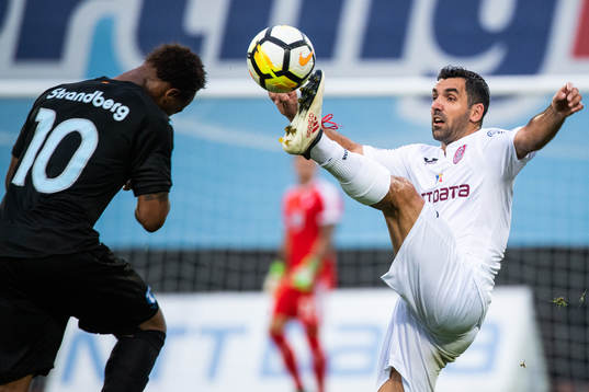 Carlos Strandberg of Malmö FF and Emmanuel Culio of Cluj