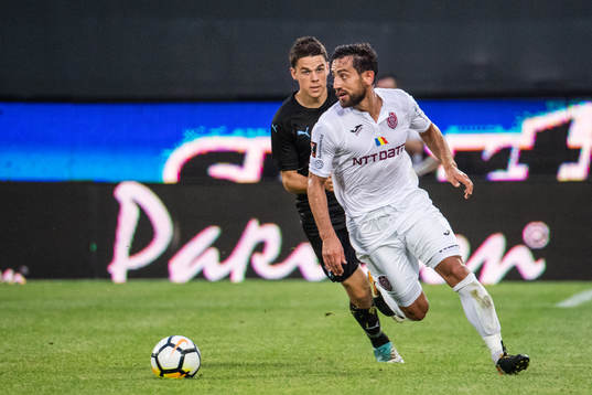 Samuel Adrian of Malmö FF chasing Mate Males of Cluj