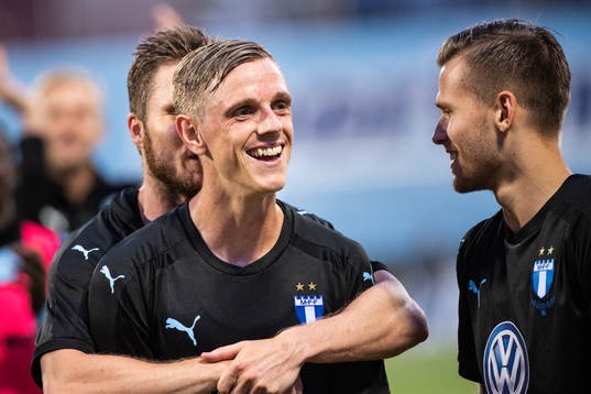 Lasse Nielsen hugs Sören Rieks of Malmö FF while