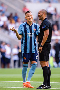 Fredrik Ulvestad of Djurgården and referee Miroslav Zelinka