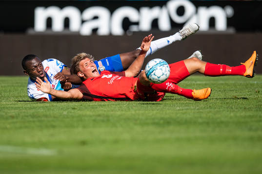 Steffen Lie Skålevik of Brann is tackled by Ben Karamoko