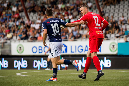 Tommy Høiland of Viking and goalkeeper Lukasz Jarosinski