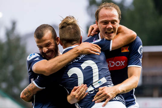Claes Kronberg of Viking celebrates with teammates Zlatko